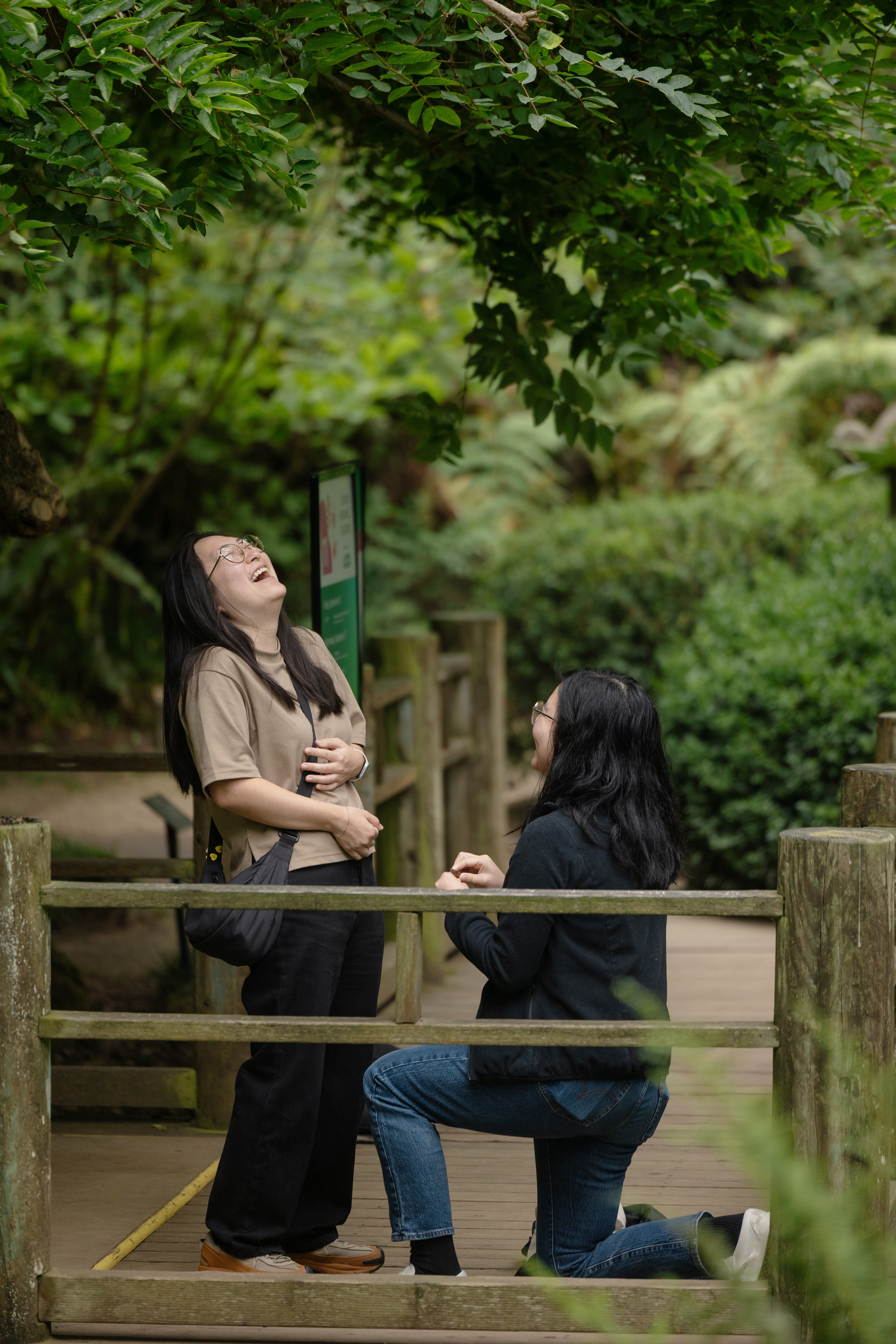 Emotional moment during the proposal at Moonview Garden just before the ring goes on